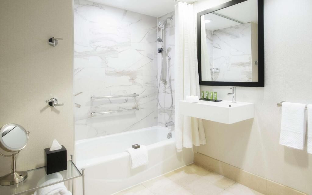 Designer toiletries, hair dryer, towels