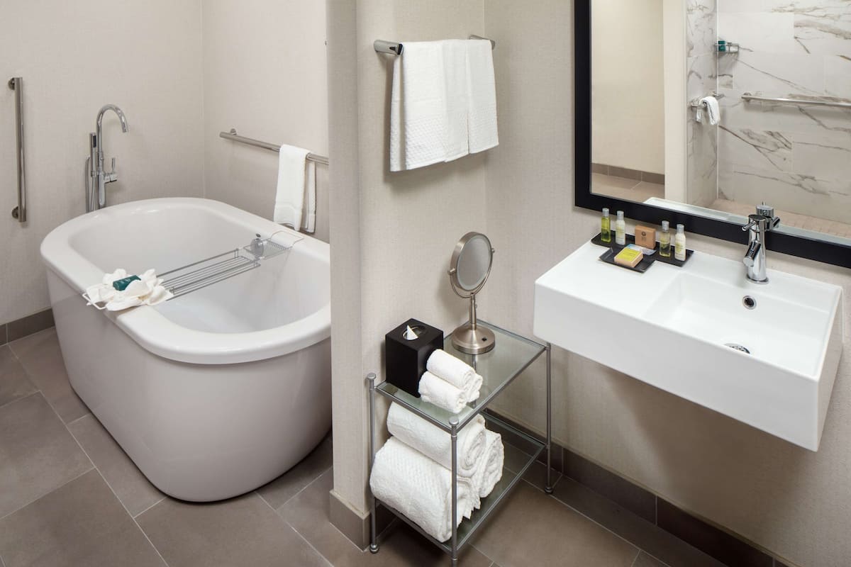 superior room, 2 queen beds (mobility & hearing, accessible bathtub) | bathroom | designer toiletries, hair dryer, towels