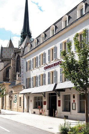 A historic building with a sign reading 'CHAPEAU ROUGE.'