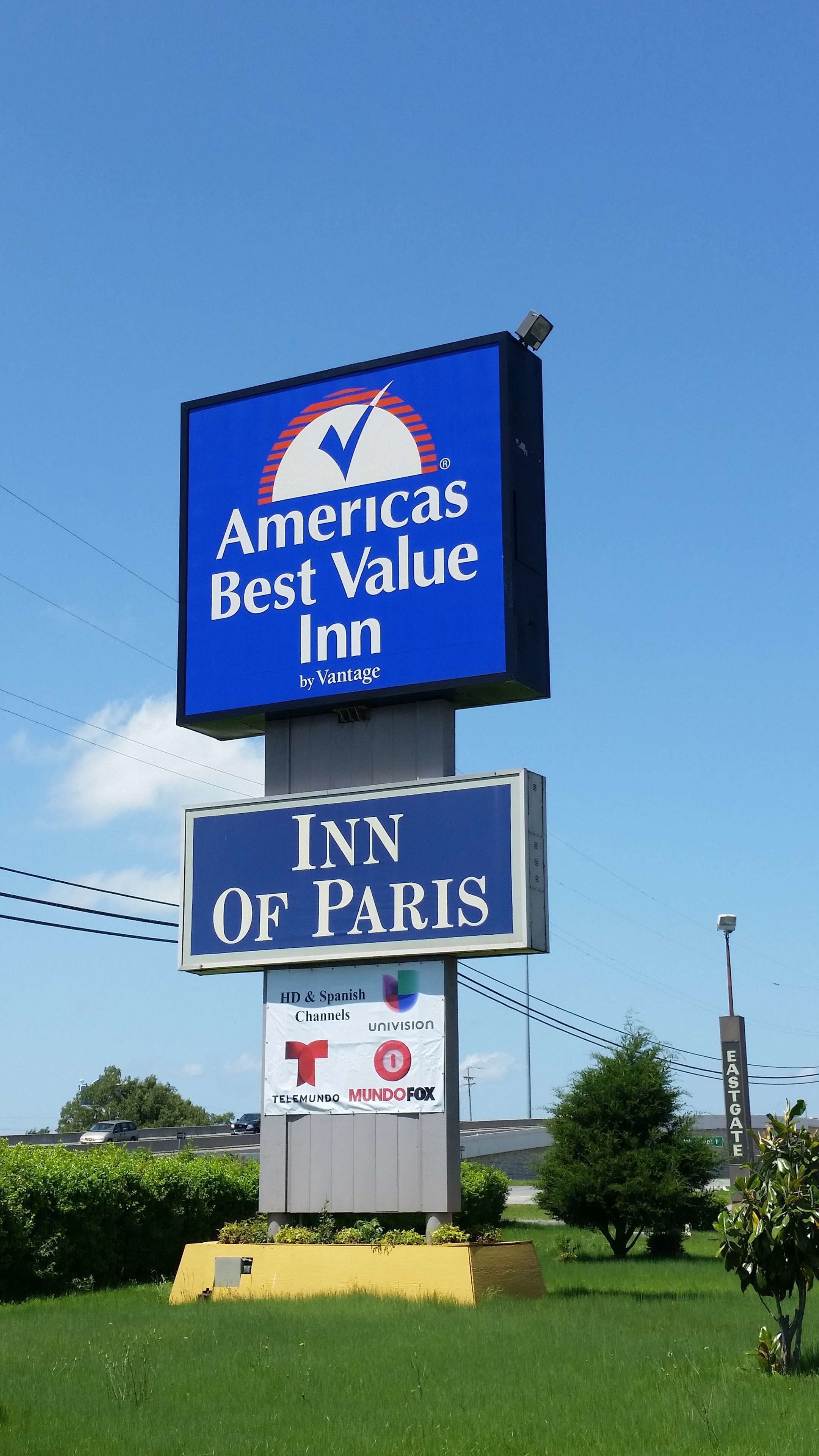 A billboard for an Americas Best Value Inn by Vantage, featuring the logo and name of the hotel.