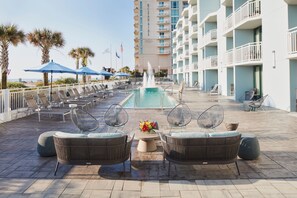 Seasonal outdoor pool, open 8:00 AM to 10:00 PM, pool umbrellas