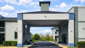 A modern building entrance with a covered walkway, numbered 2709, leading to a parking area. - Rodeway Inn Killeen near Fort Hood (Killeen)