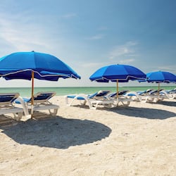 On the beach, beach cabanas, beach towels, beach volleyball