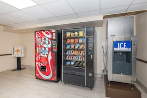 A vending machine area with a Coca-Cola branded machine, a snack vending machine, and an ice dispenser. - City Express by Marriott Knoxville (Knoxville)