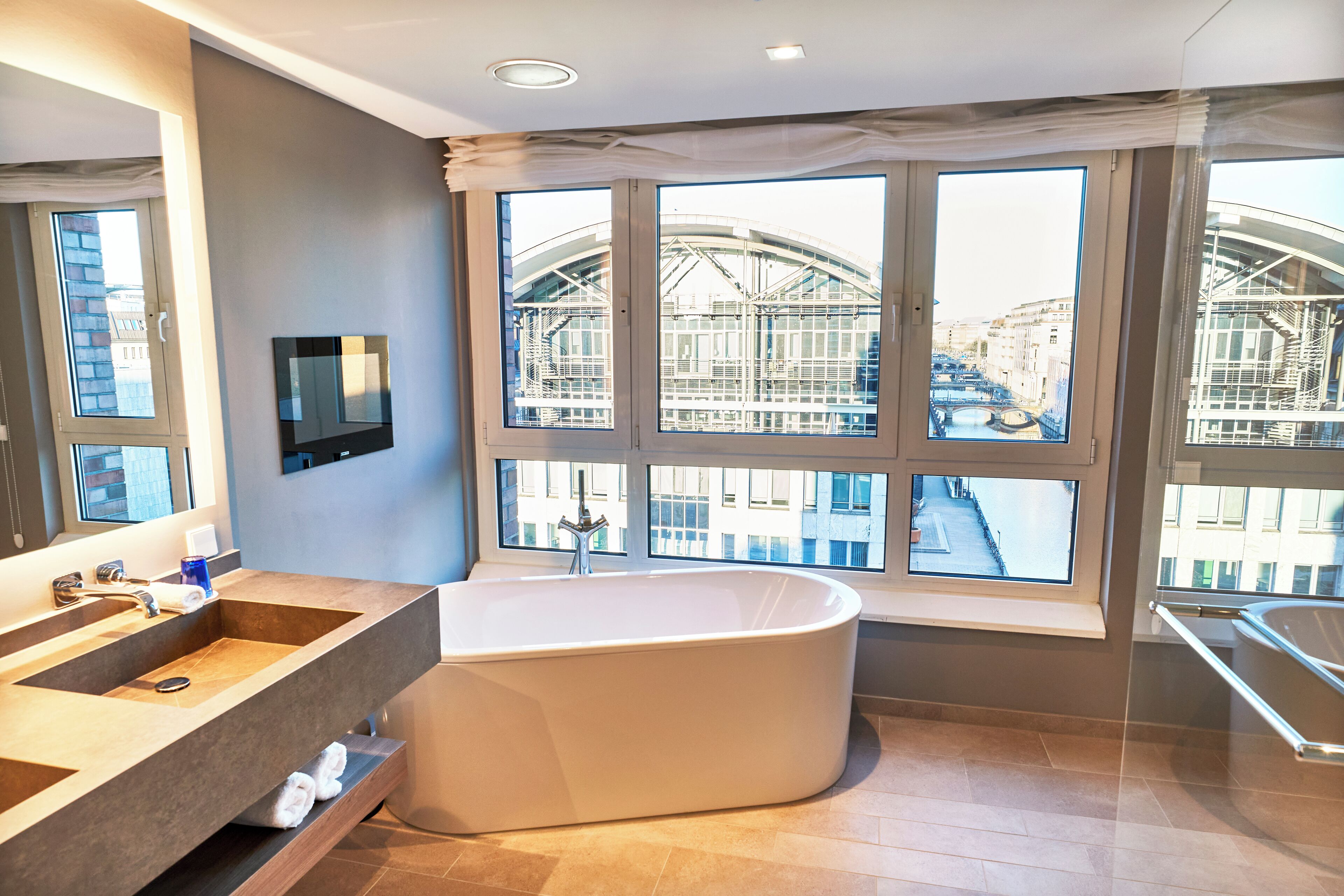 deluxe suite | bathroom | designer toiletries, hair dryer, bathrobes, slippers