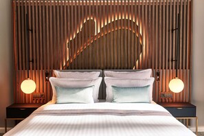 Hypoallergeen beddengoed, donsdekens, pillowtop-bedden, een minibar