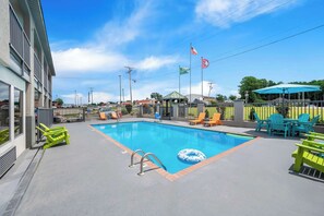 Relax by the pool surrounded by comfortable seating and a secure, area.