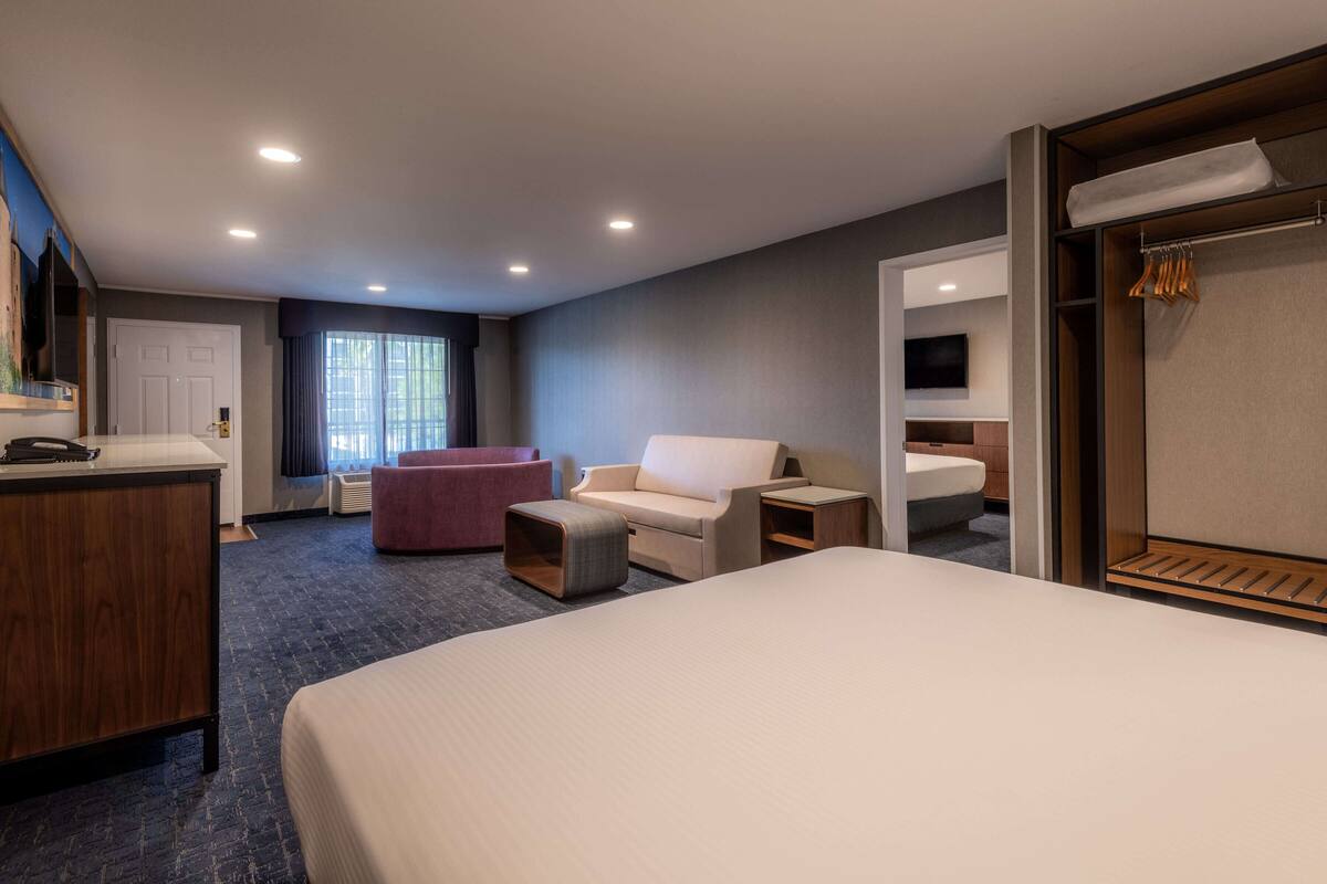 two room family suite | 2 bedrooms, in-room safe, blackout curtains, iron/ironing board