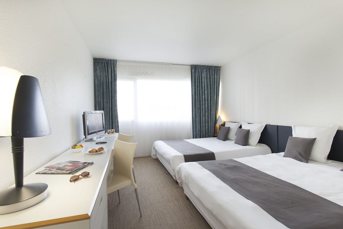 Family Room | Premium bedding, desk, blackout curtains, soundproofing