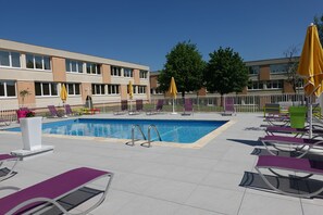 Outdoor pool, open 9 AM to 8 PM, pool umbrellas, pool loungers