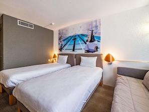 Luxe beddengoed, een minibar, een kluis op de kamer