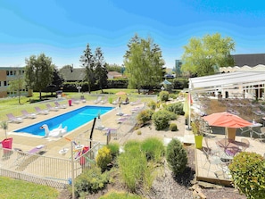 Outdoor pool, open 9 AM to 8 PM, pool umbrellas, pool loungers