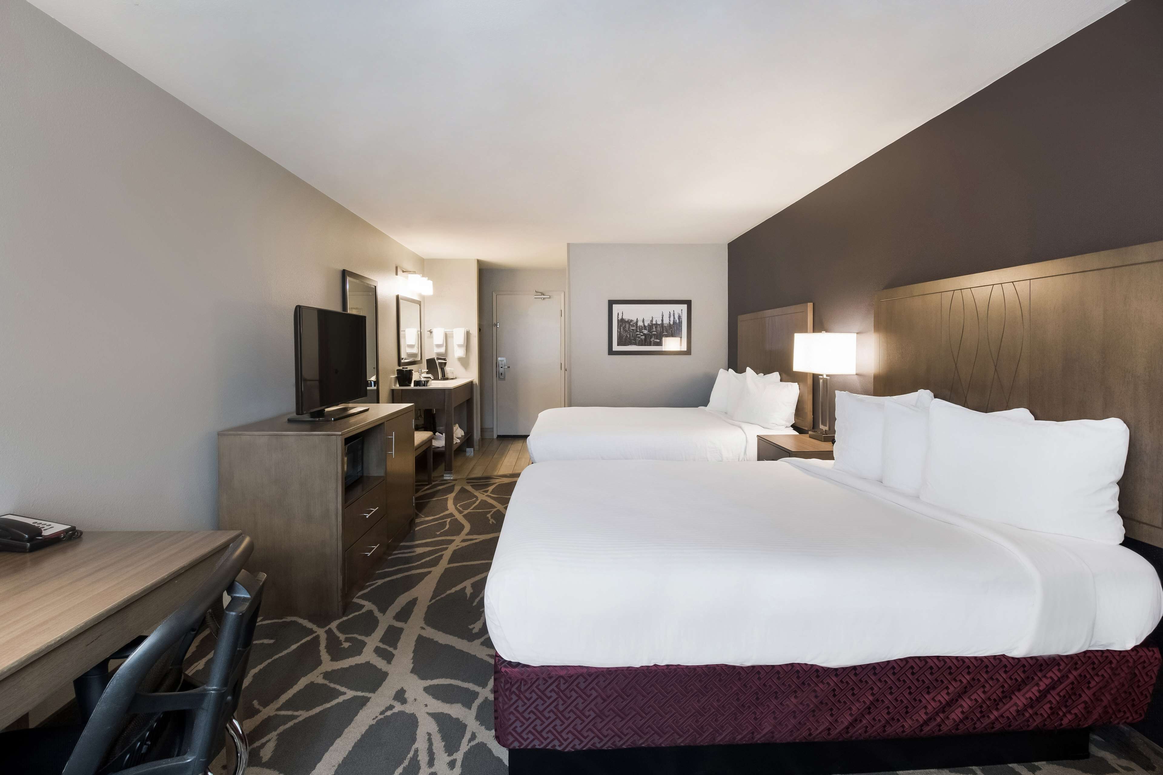 standard room, 2 queen beds, non smoking, refrigerator & microwave | desk, laptop workspace, blackout curtains, iron/ironing board