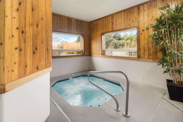 Indoor pool, open 6:00 AM to 11:00 PM, pool loungers