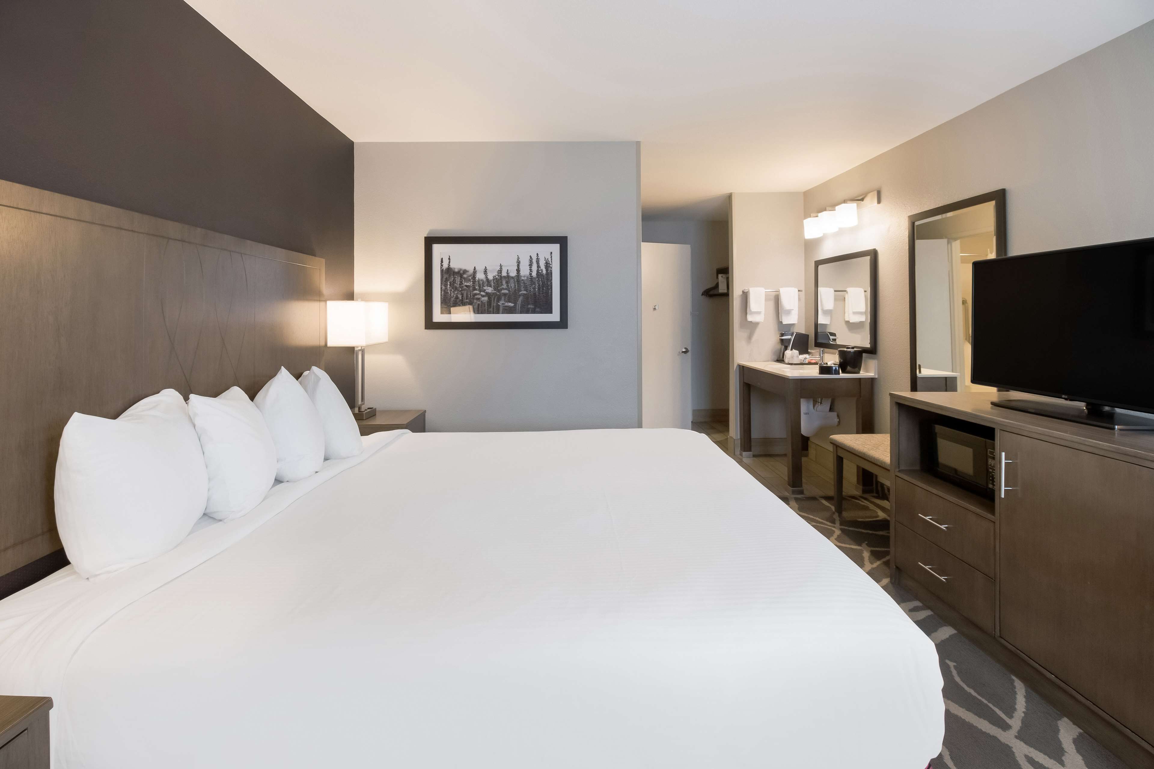 desk, laptop workspace, blackout curtains, iron/ironing board