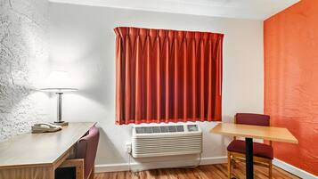 Desk, laptop workspace, blackout drapes, iron/ironing board