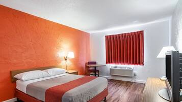 Desk, laptop workspace, blackout drapes, iron/ironing board