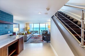 HONEYMOON SUITE- OCEAN AND GARDEN VIEW- 1KNG | Living area | 27-inch LCD TV with cable channels, TV, pay movies