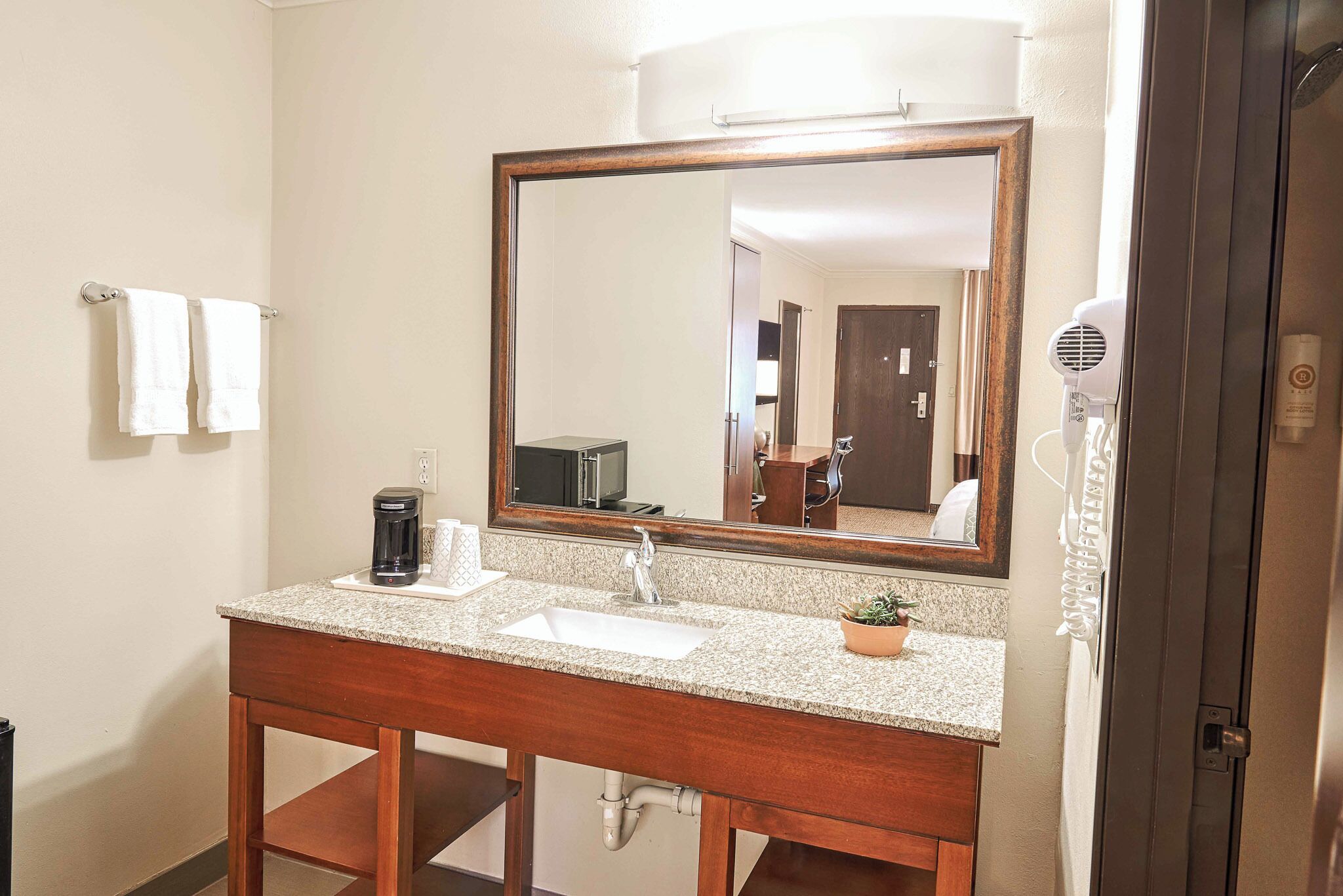 eco-friendly toiletries, hair dryer, towels, soap