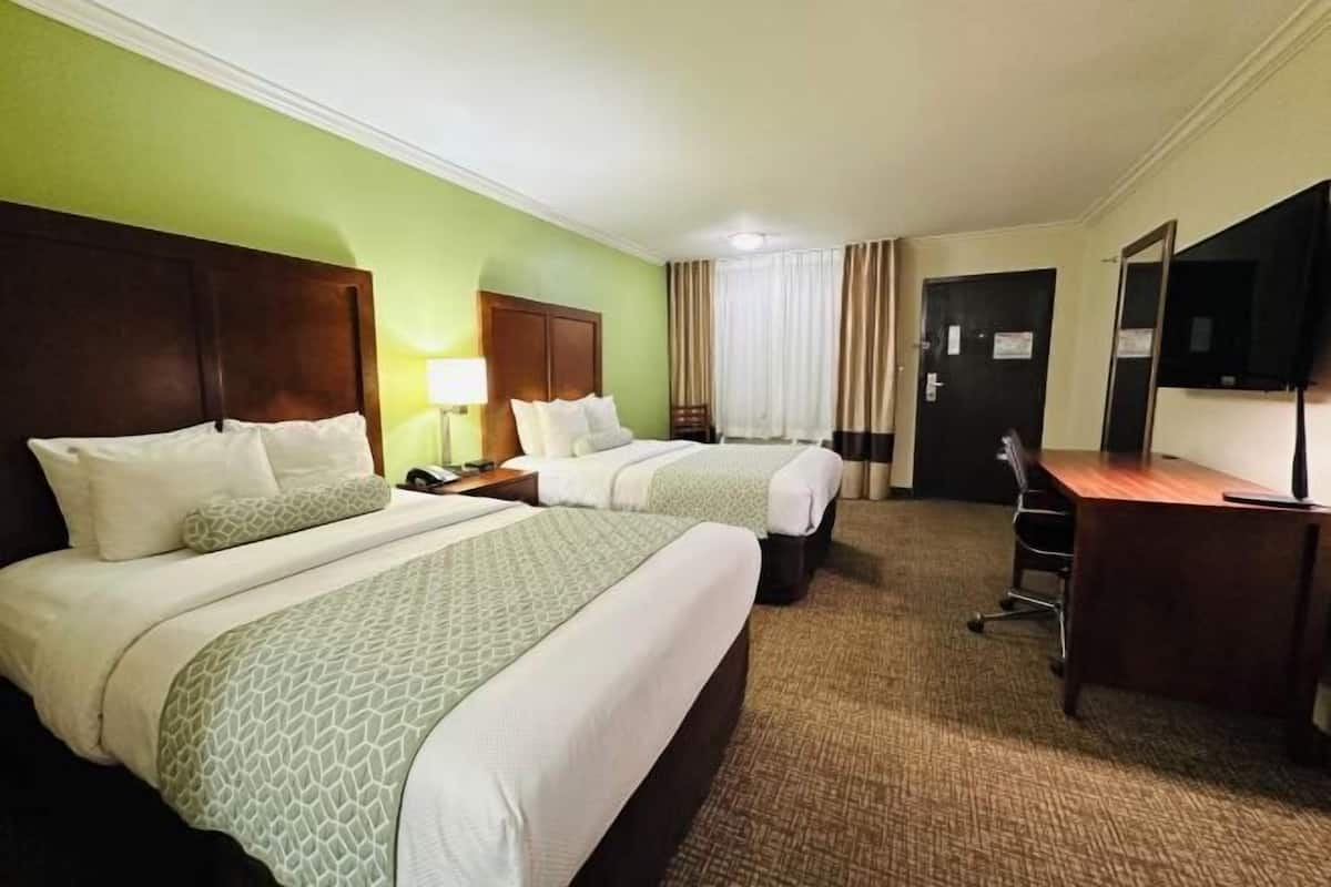 Down comforters, pillowtop beds, in-room safe, desk