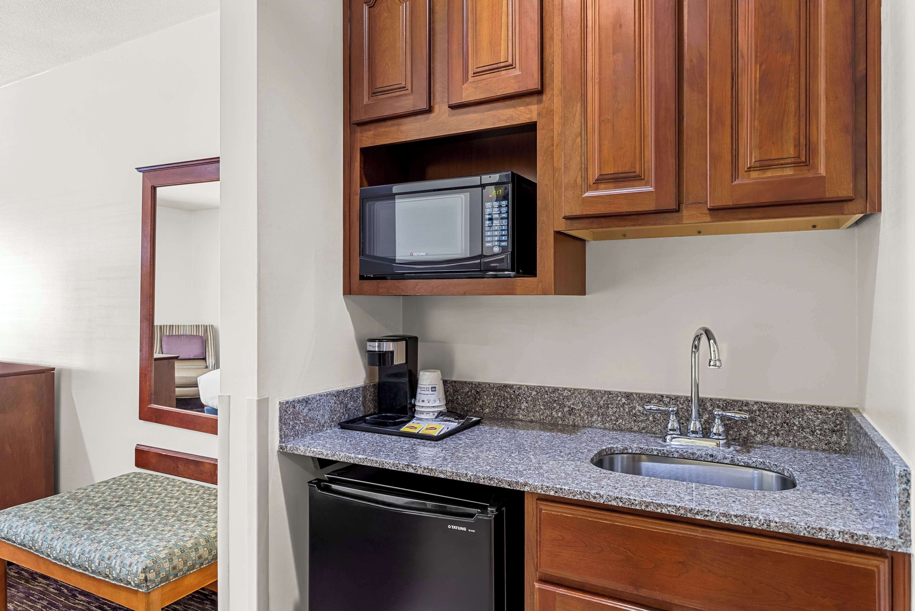 suite, 1 king bed, non smoking, refrigerator & microwave | in-room safe, desk, iron/ironing board, wifi