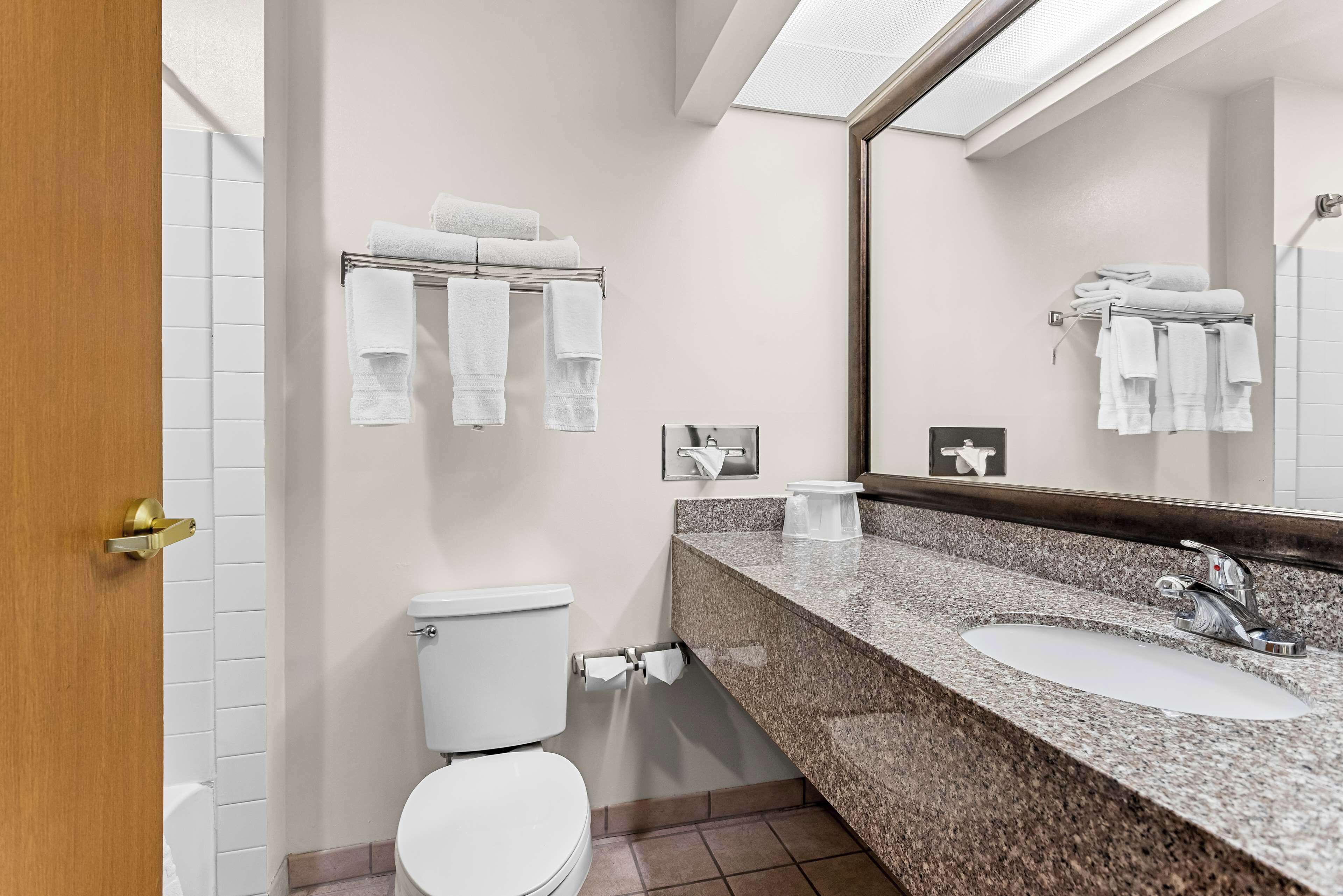 suite, 1 king bed, non smoking, refrigerator & microwave | bathroom | combined shower/bathtub, eco-friendly toiletries, hair dryer, towels