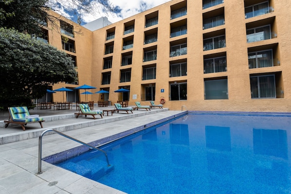 Outdoor pool, open 7:00 AM to 7:00 PM, pool umbrellas, sun loungers