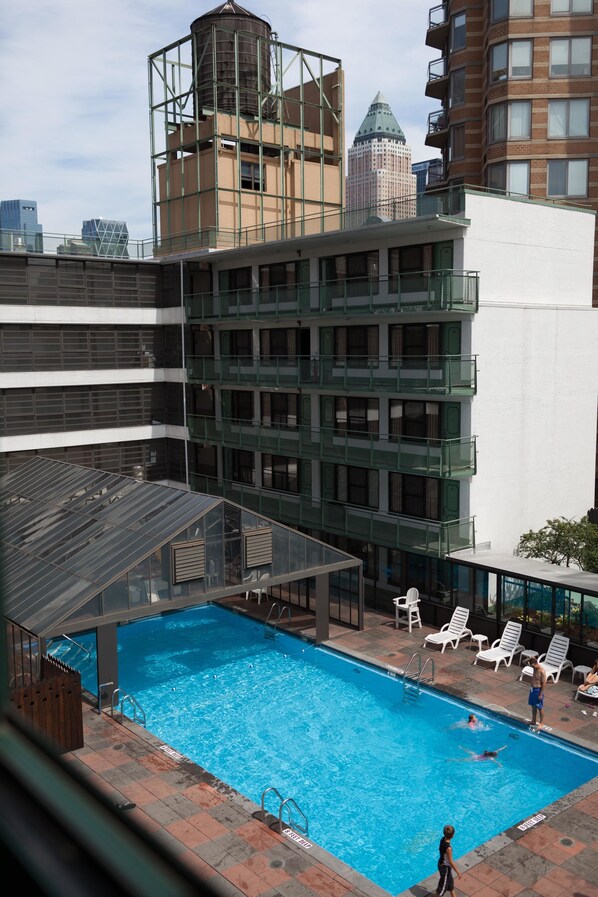 Seasonal outdoor pool, pool loungers