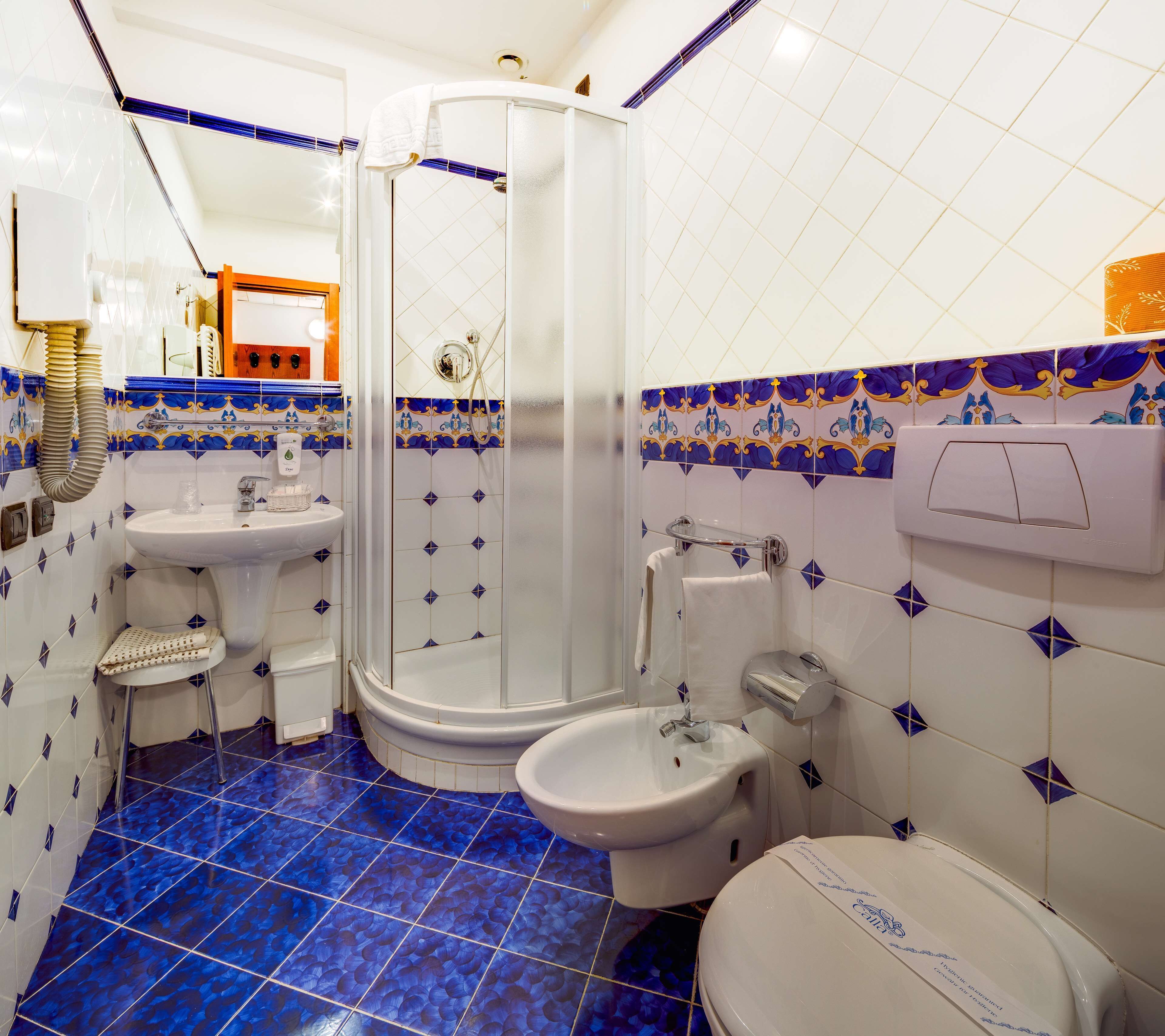 eco-friendly toiletries, hair dryer, slippers, bidet