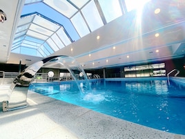 Indoor pool, open 9:00 AM to 9:00 PM, pool loungers, lifeguards on site
