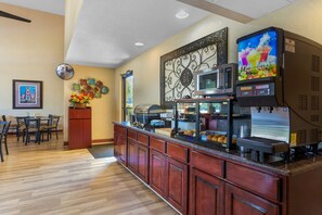 Enjoy a restful stay in this well-appointed room with a comfortable bed and functional bedside table.