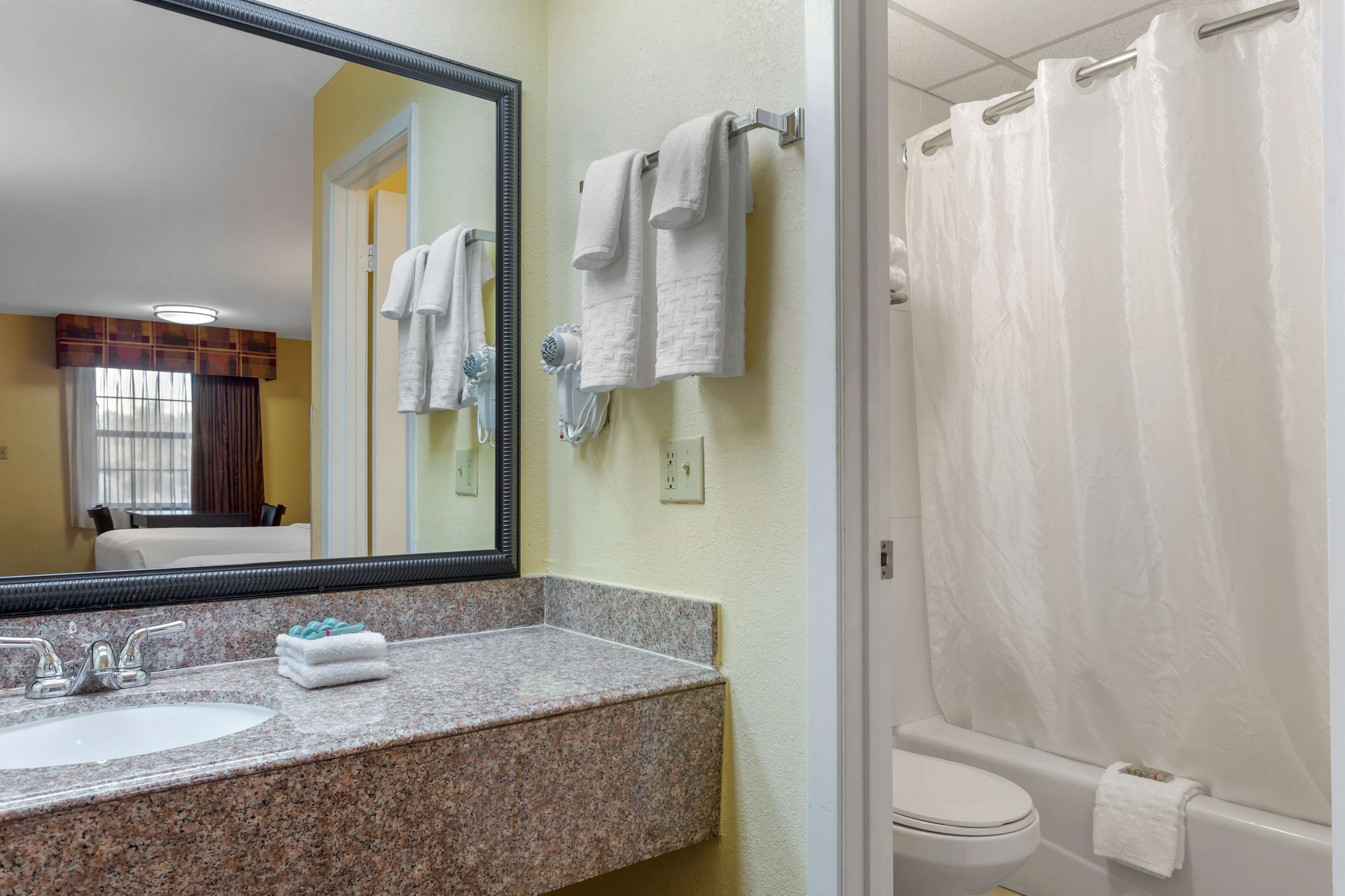 combined shower/bathtub, eco-friendly toiletries, hair dryer, towels
