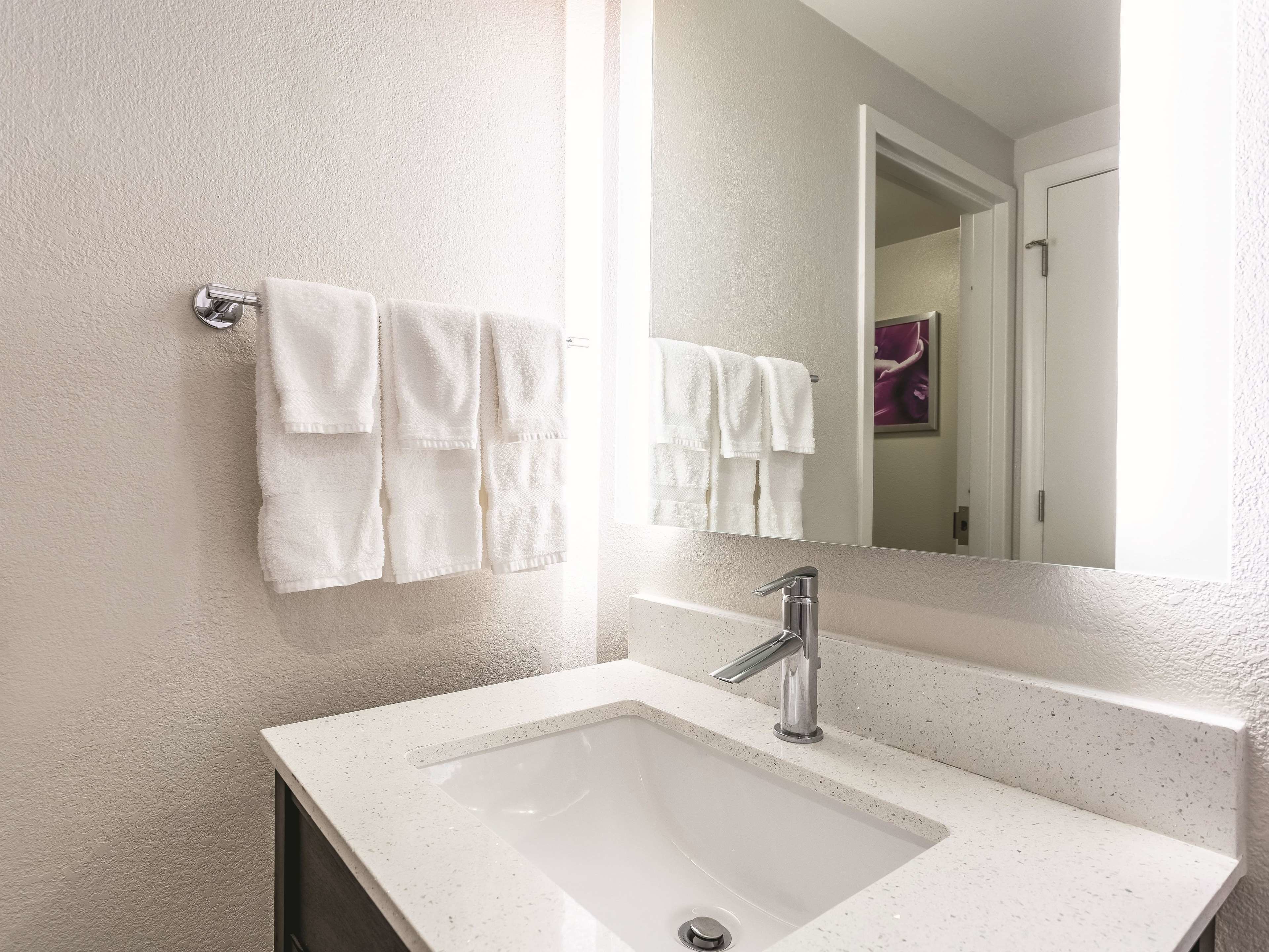 eco-friendly toiletries, hair dryer, towels