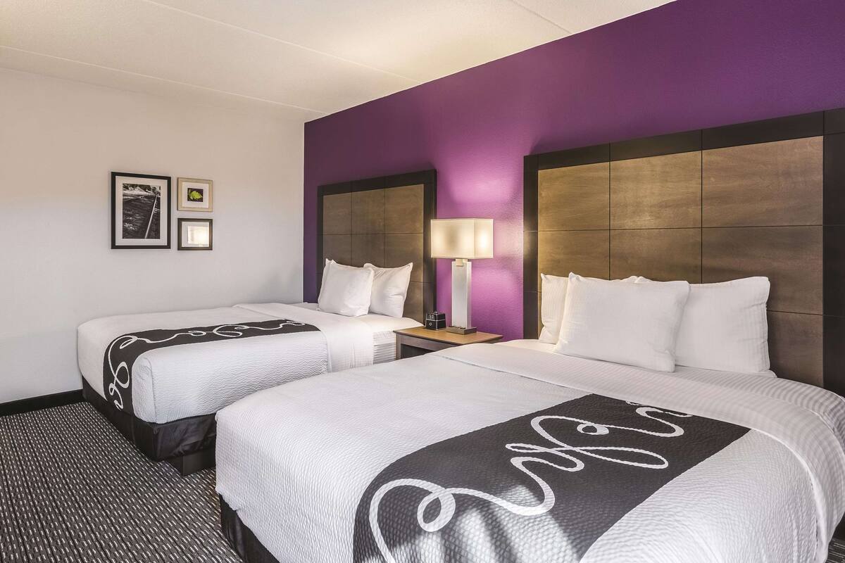 Premium bedding, desk, laptop workspace, blackout curtains