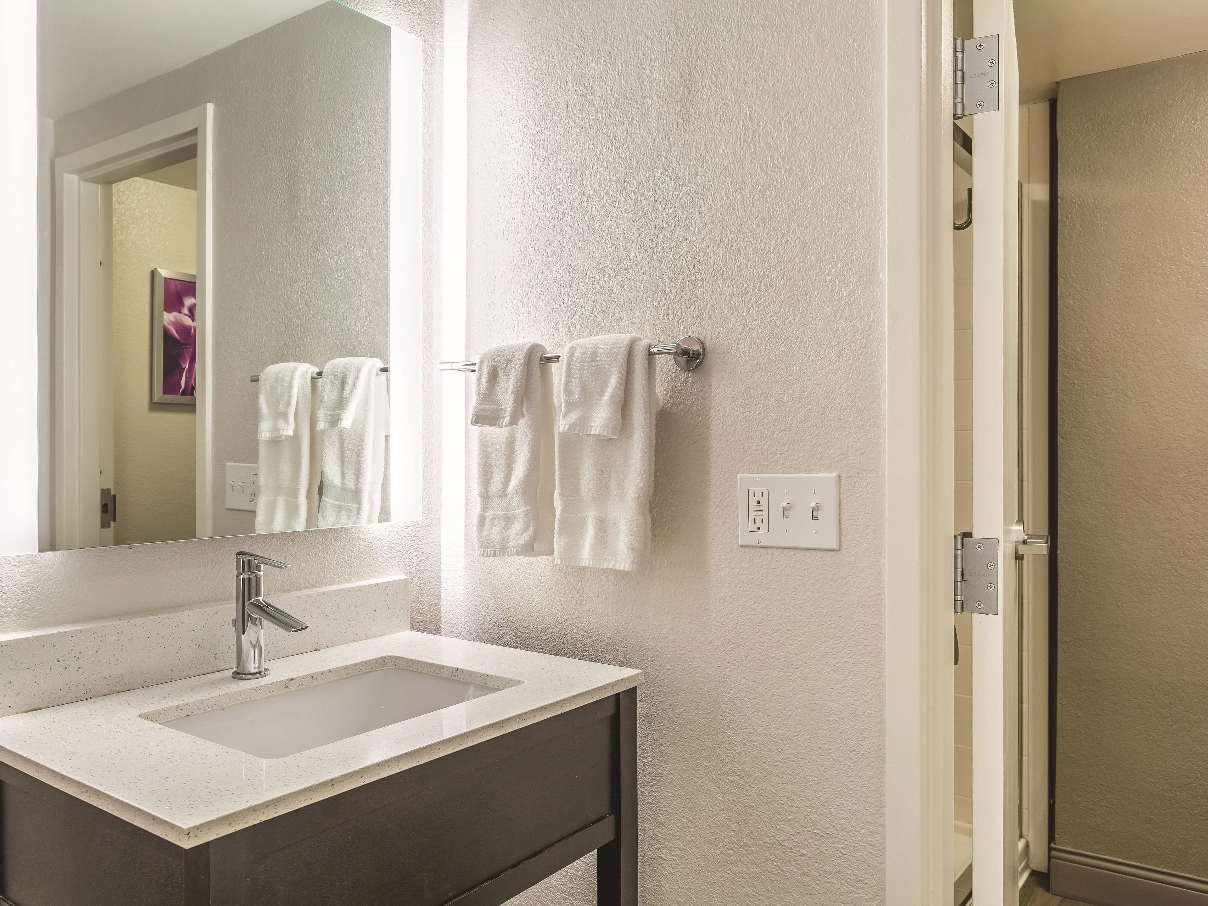 eco-friendly toiletries, hair dryer, towels