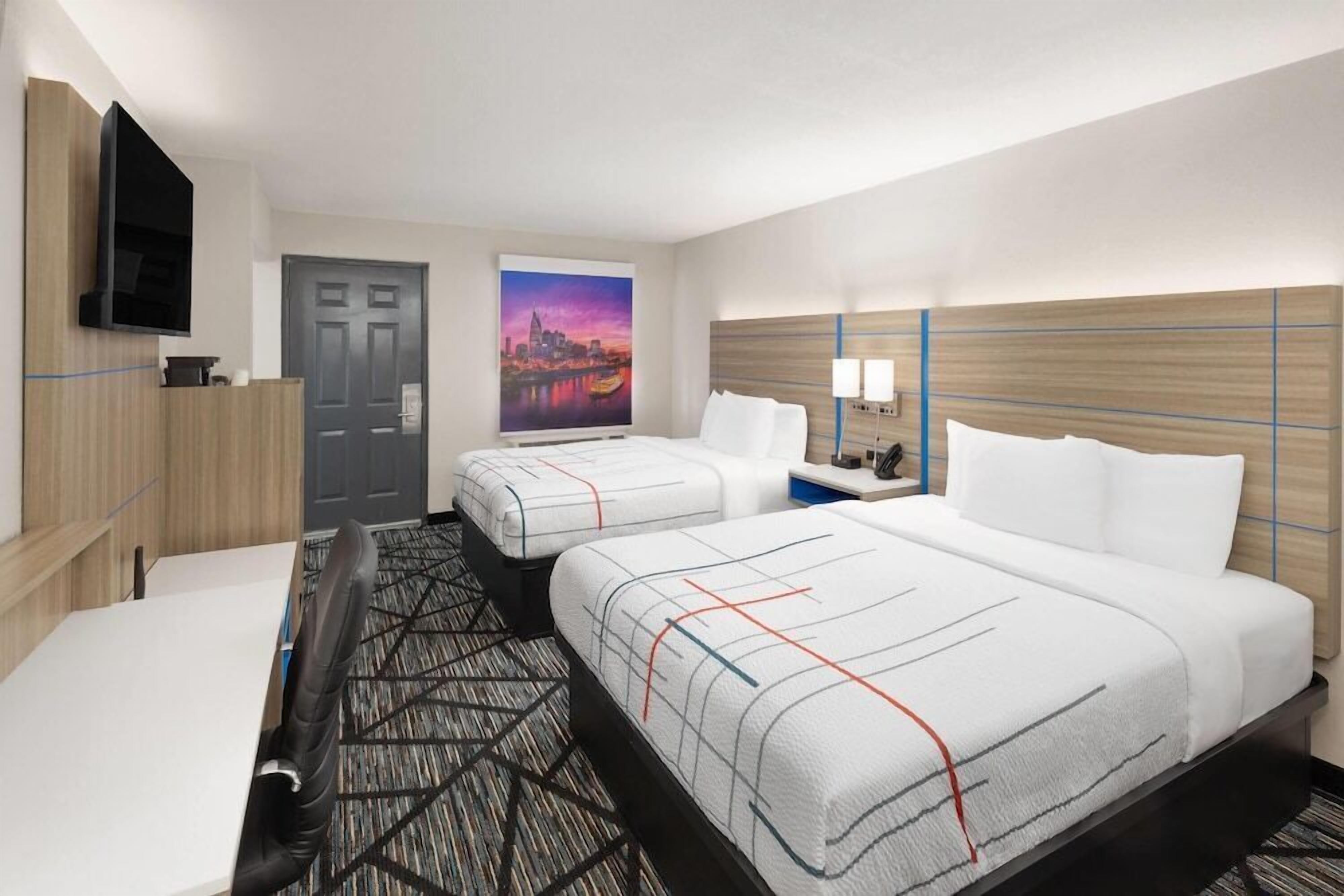 Pillowtop beds, desk, laptop workspace, blackout drapes