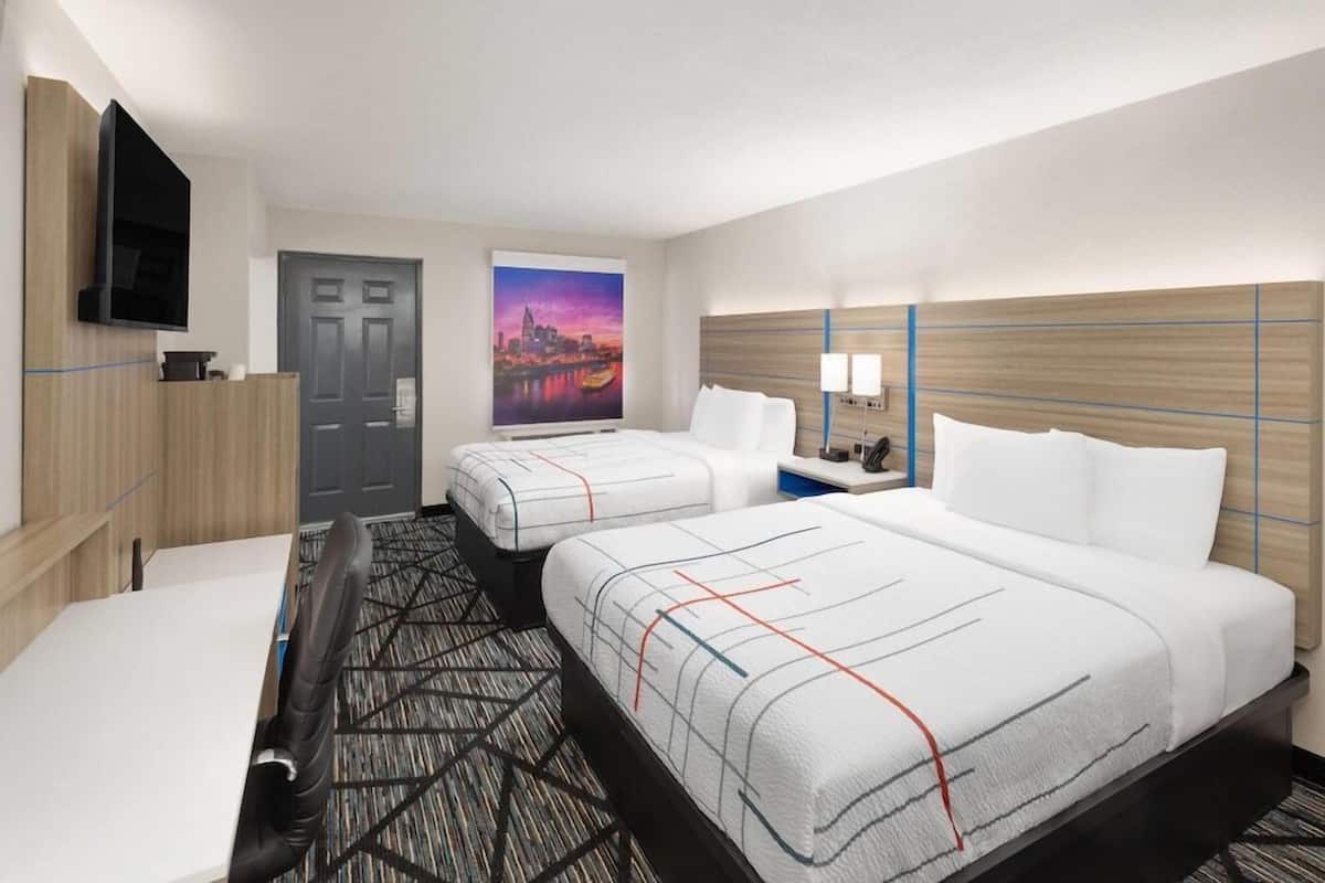 Pillowtop beds, desk, laptop workspace, blackout drapes