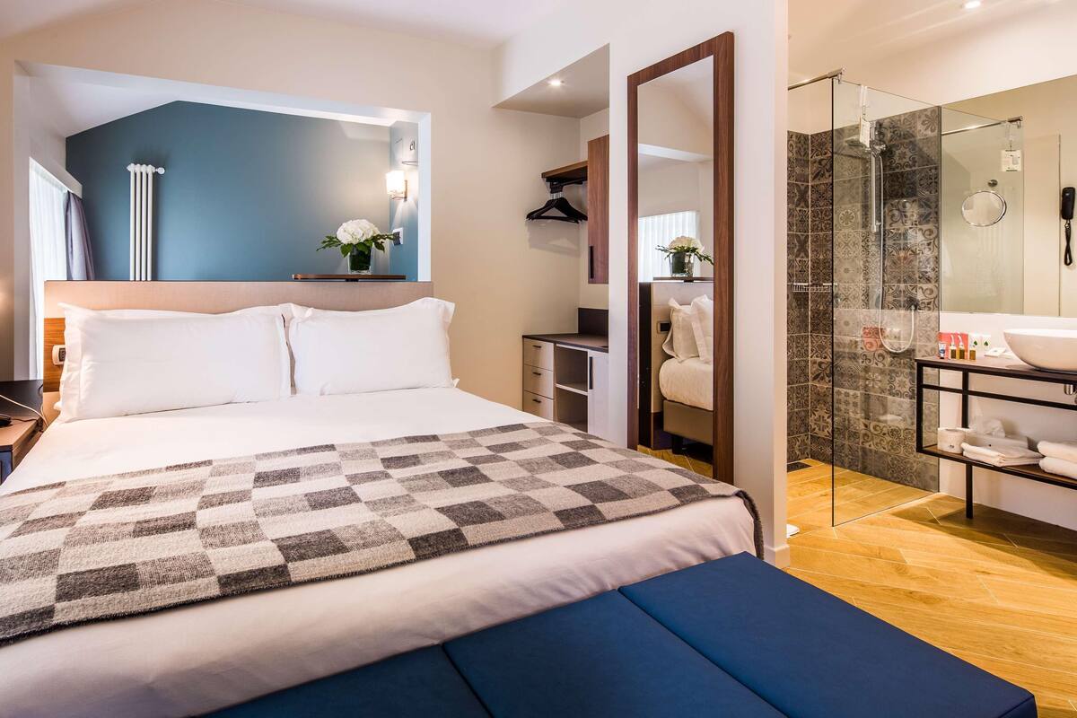 Down comforters, memory foam beds, minibar, in-room safe