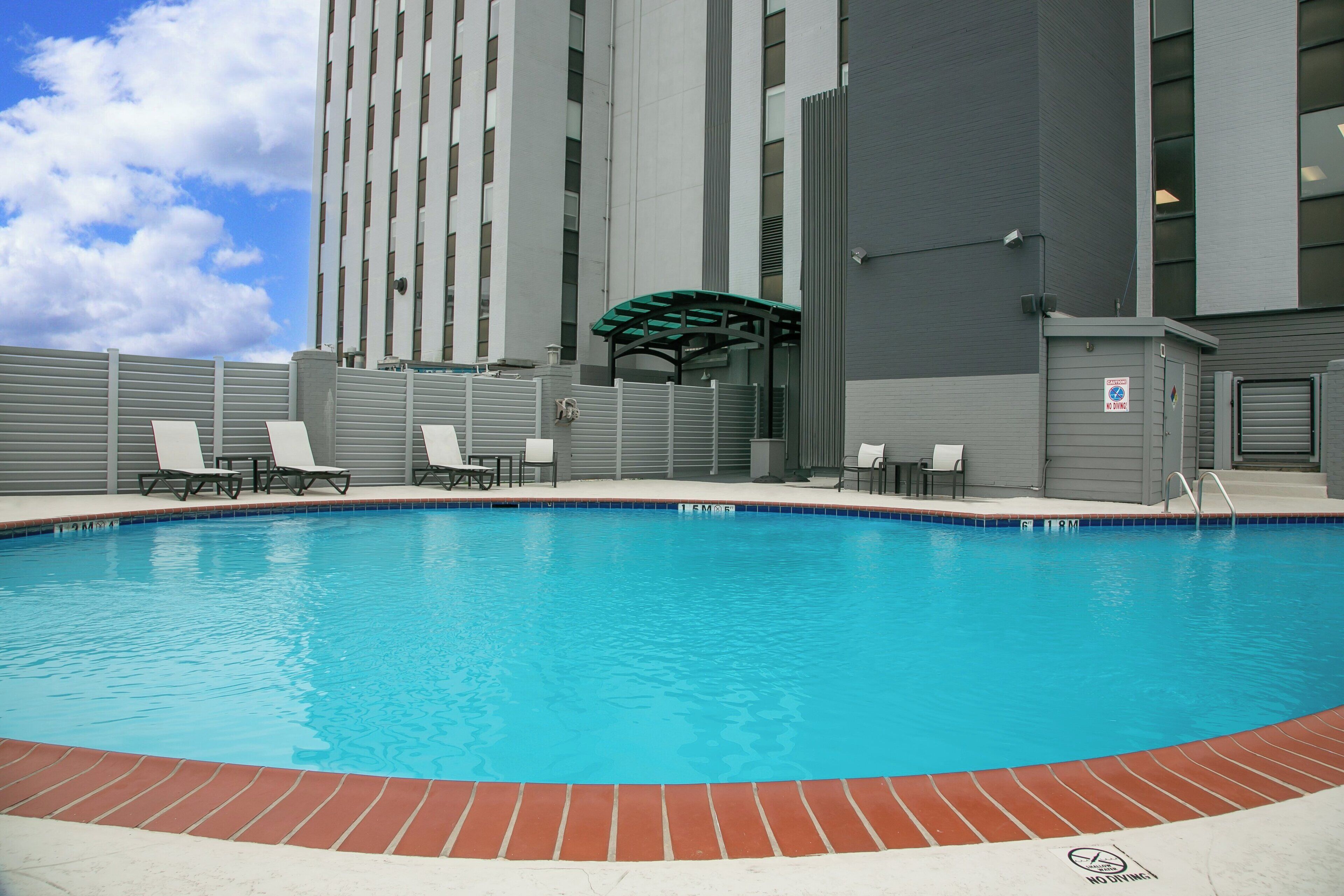 Outdoor pool, open 9:00 AM to 10:00 PM, pool loungers
