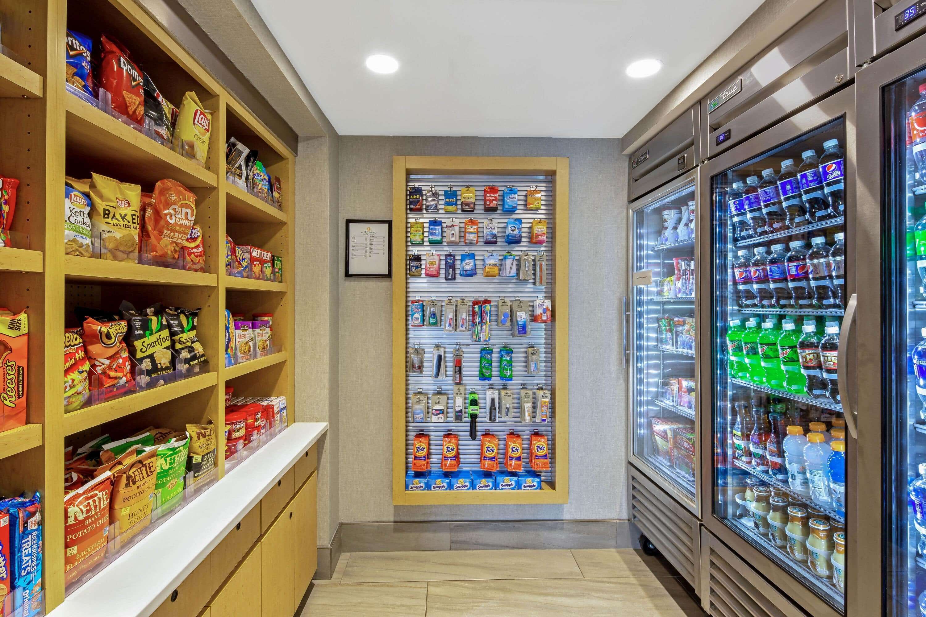 A snack and beverage vending area with various snacks and drinks.
