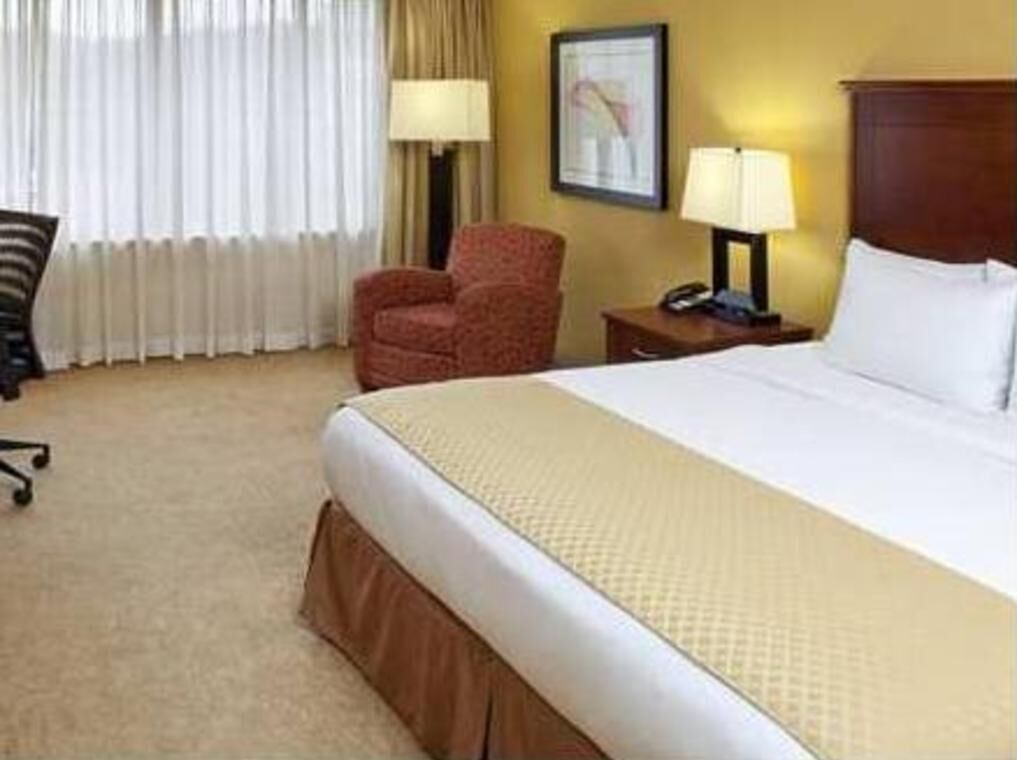 Premium bedding, desk, blackout drapes, iron/ironing board