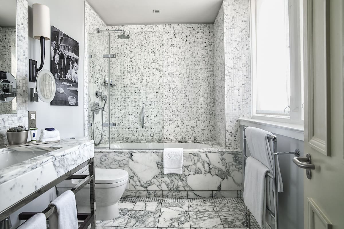 Shower, designer toiletries, hair dryer, bathrobes