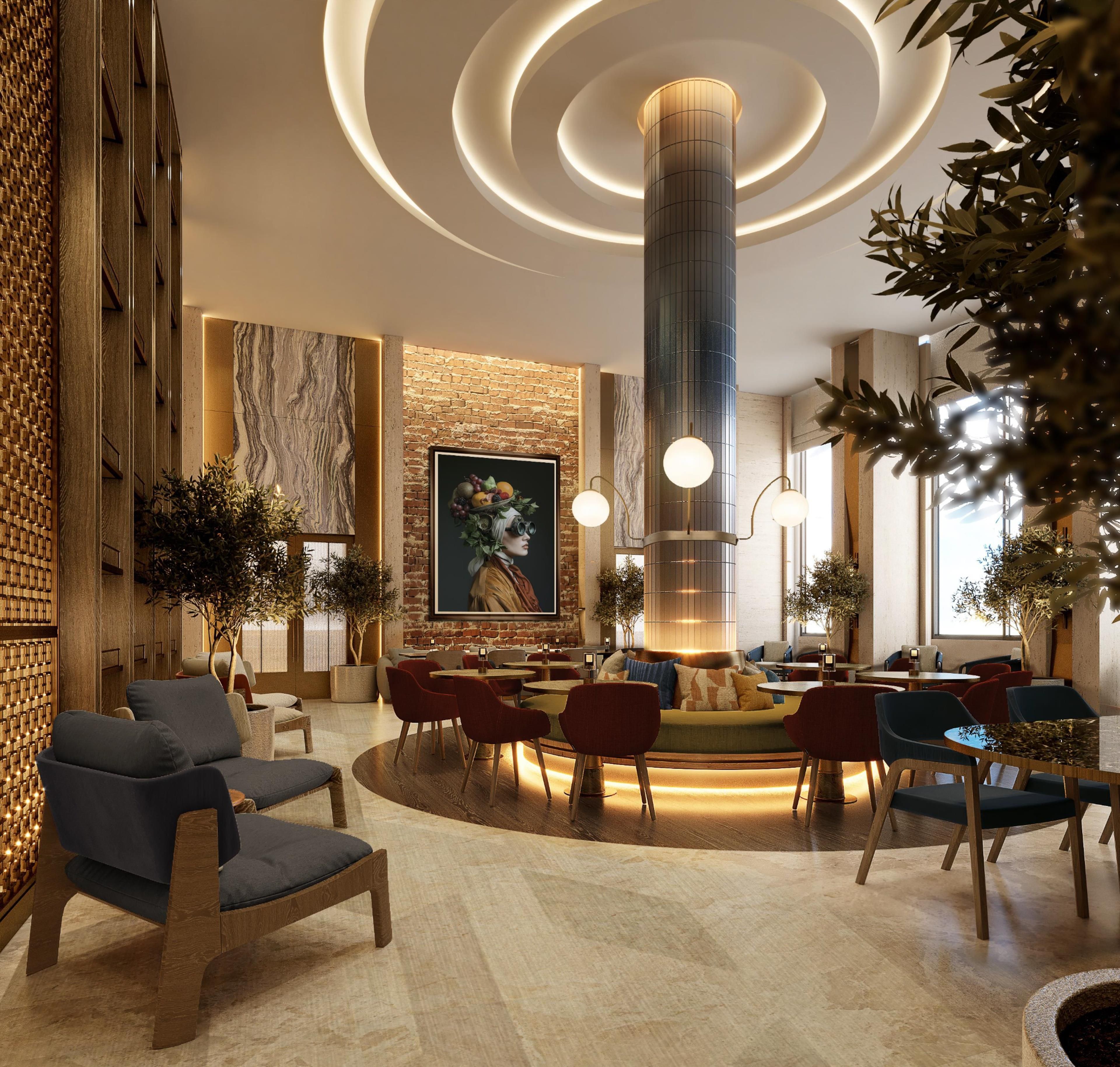 A modern lobby with a central seating area, a large mural, and a distinctive cylindrical light fixture.