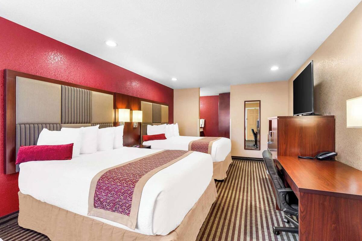 Pillow-top beds, desk, laptop workspace, blackout curtains