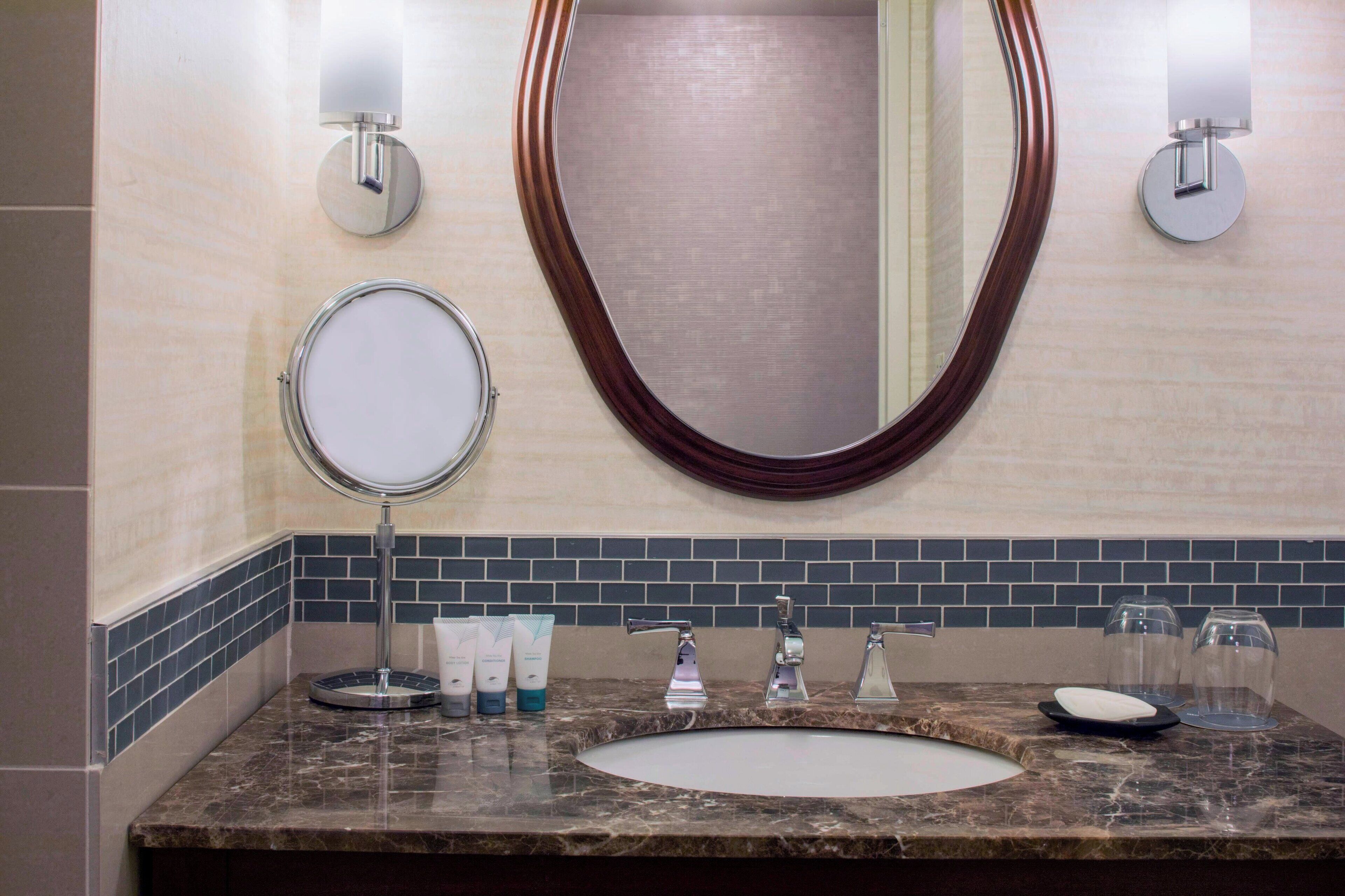 designer toiletries, hair dryer, towels, soap