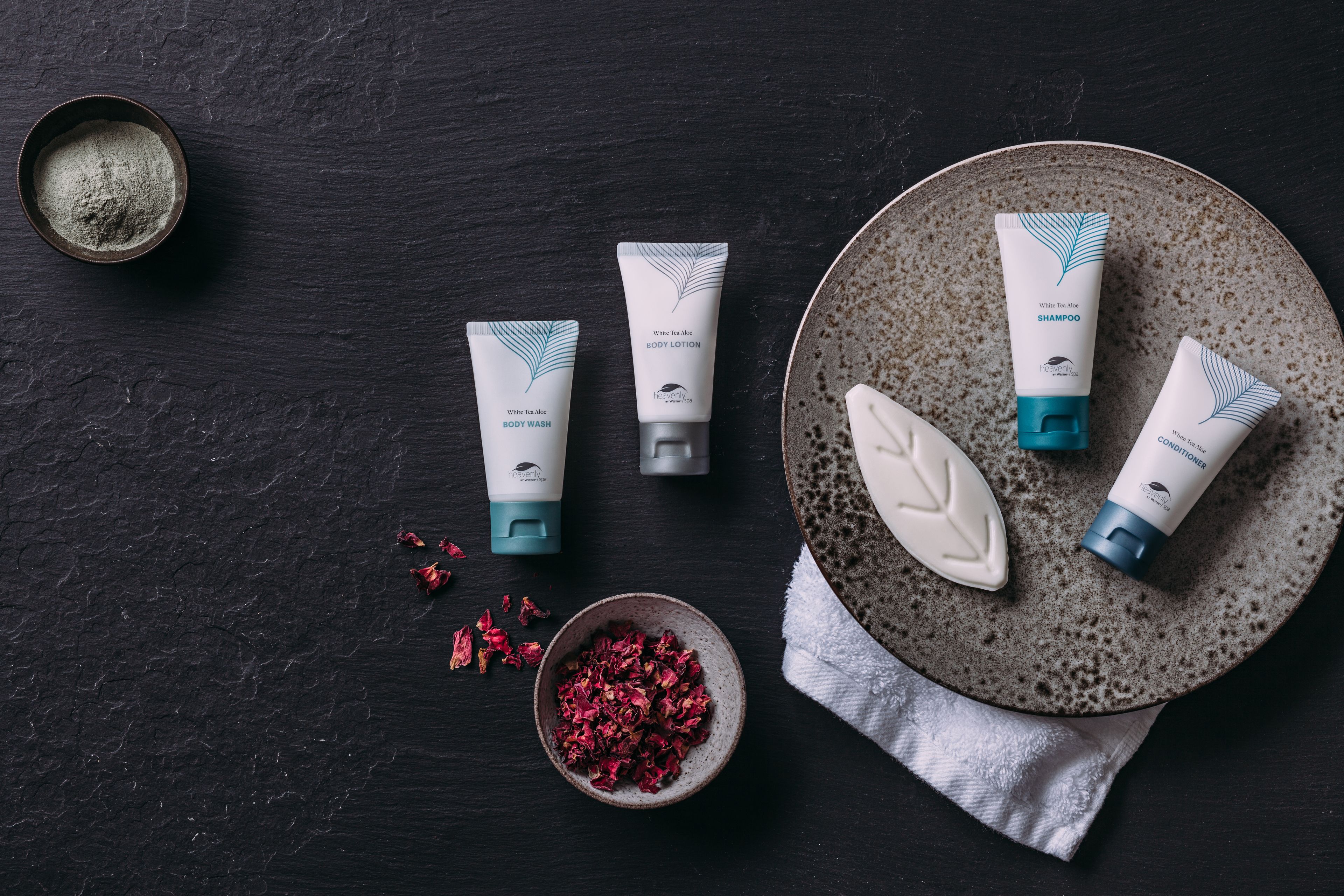 designer toiletries, hair dryer, towels, soap