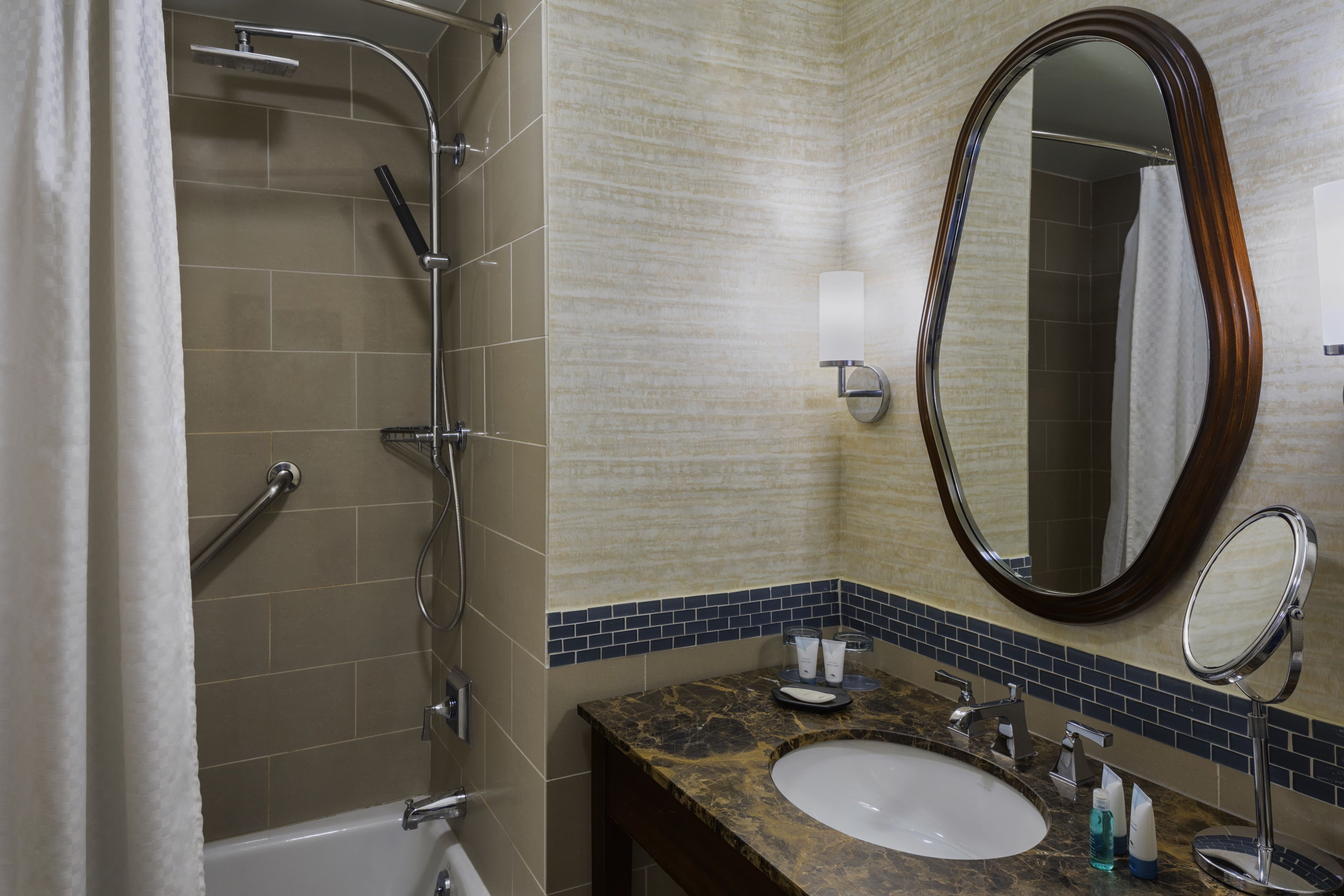 designer toiletries, hair dryer, towels, soap