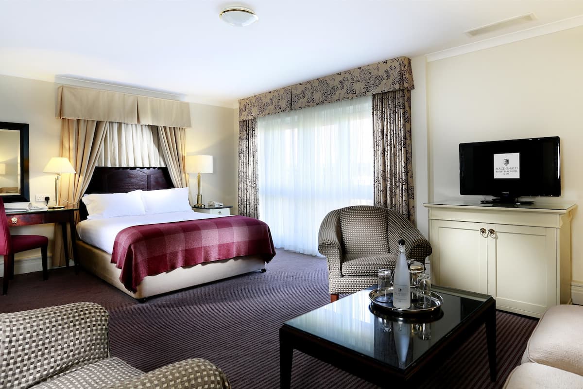 premium bedding, desk, blackout curtains, iron/ironing board