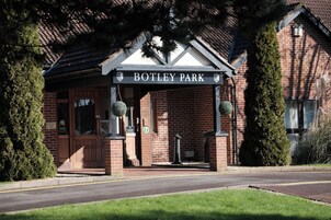 A brick building with a sign reading "BOTLEY PARK".