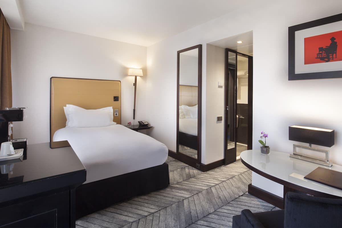 Habitación clásica, 1 cama individual | 1 dormitorio, ropa de cama de alta calidad, minibar y caja fuerte